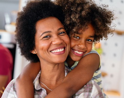 Mother and son smiling